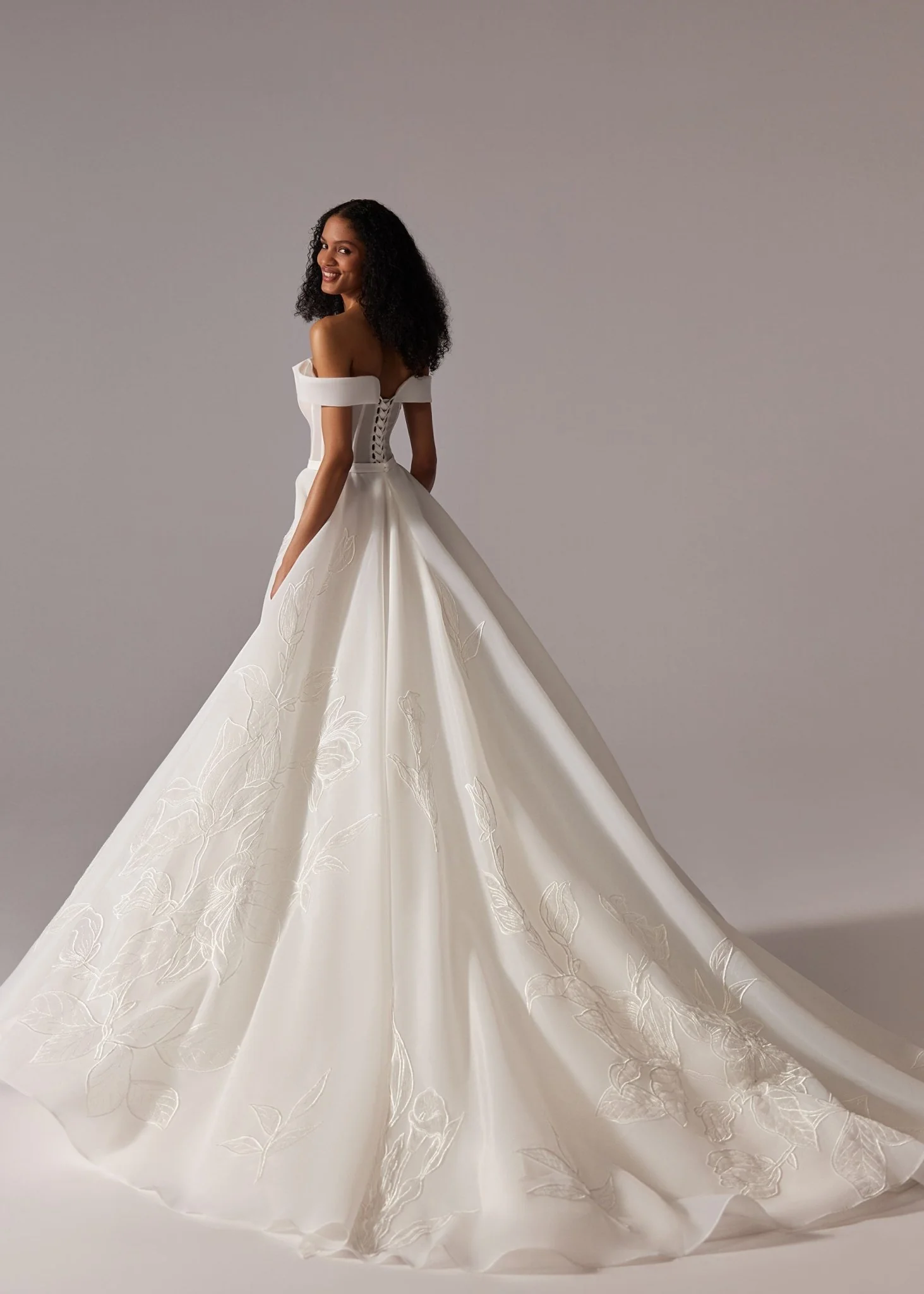 White Off-Shoulder Ball Gown Wedding Dress with Embroidered Skirt and Dramatic Train - Plus Size - Image 3